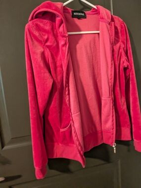 Beta House pink velour zip-up hoodie features a plush fabric and front pockets.